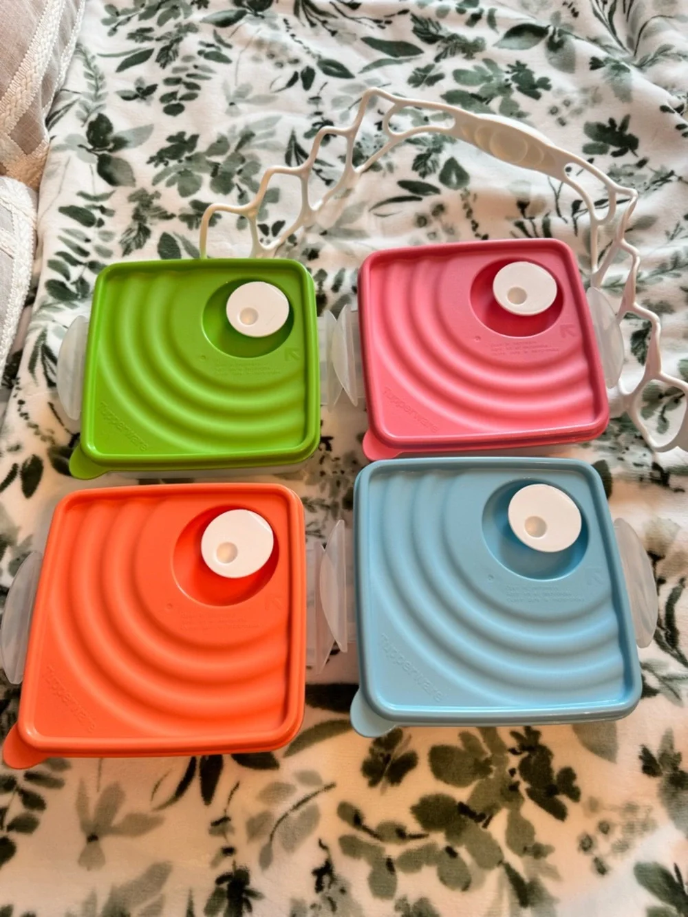 Tupperware Stacked food storage containers with carrier handle